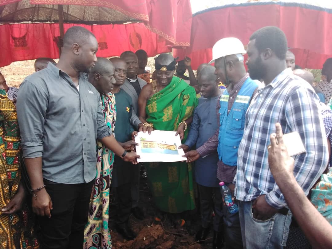 Nana Ampofo Twumasi  III being handed with the plan for STEM school